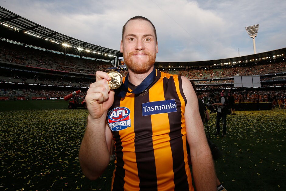 2015 Toyota AFL Grand Final - Hawthorn v West Coast MELBOURNE, AUSTRALIA - OCTOBER 3: Jarryd Roughead of the Hawks shows off his premiership medal after the 2015 Toyota AFL Grand Final match between the Hawthorn Hawks and the West Coast Eagles at the Melbourne Cricket Ground, Melbourne, Australia on October 3, 2015. (Photo by Darrian Traynor/AFL Media)